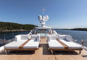 chic oversized sun-loungers on the sundeck of charter yacht LILI