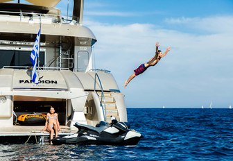 charter guest jumps off yacht into blue water