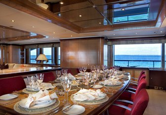 dining table set up for a formal dinner in the main salon aboard motor yacht JAGUAR 