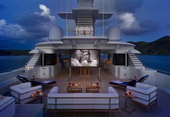 Outdoor cinema set up on sun deck of luxury yacht Victoria del Mar at twilight