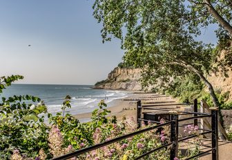 little beach framed by green trees on the isle of wight, exciting new english yacht charter destination