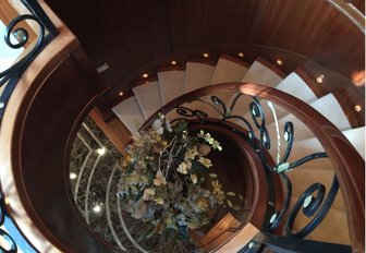 The spiral staircase featured in the interior of luxury yacht APOGEE