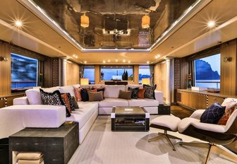 L-shaped sofa and armchair in the skylounge aboard motor yacht DENIKI 