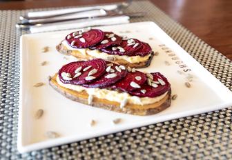 Close-up shot of beetroot and seeds on toast at Boroughs restaurant Abu Dhabi