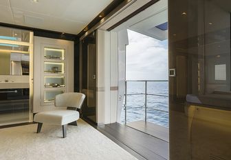 the balcony of charter yacht EVA. 4EVA with plush lounging chair