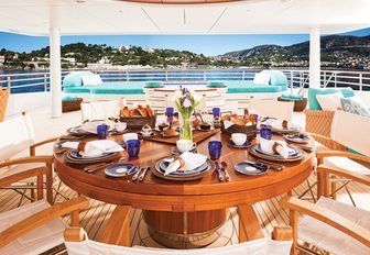 circular table on the sundeck of motor yacht Baton Rouge set up for breakfast