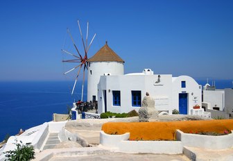 White house on cliff overlooking sea