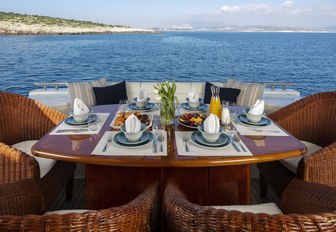 dining table set up for breakfast on the aft deck of motor yacht ASTARTE 