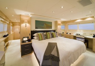 large bed in the centre of the master suite on board luxury yacht  SALU