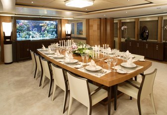 formal dining area in the main salon of luxury yacht WHEELS