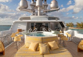 Jacuzzi with swim-up bar and sunpads on board luxury yacht My Seanna