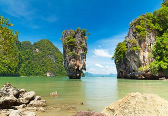 limestone karsts rise out of the water near Phuket in Thailand