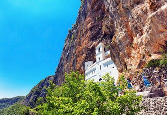 Ostrog Orthodox monastry perches on rocky cliff in Montenegro