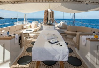 massage table set up under the shade on the sundeck of superyacht PANTHALASSA 