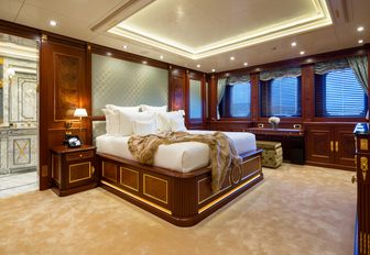 Guest cabin onboard charter yacht BLACK PEARL with central berth and three windows