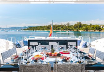 alfresco dining setup on the sundeck of luxury yacht Da Vinci 