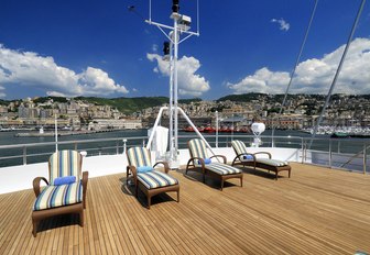 Sunloungers lined up on aft deck of megayacht Lauren L