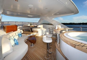 Jacuzzi, swim up bar and seating area on the sundeck of luxury yacht SOLIS