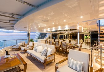 seating and al fresco dining areas on the upper deck aft of superyacht ‘King Baby’ 