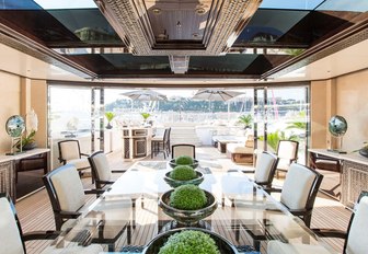 dining on sundeck of motor yacht illusion v