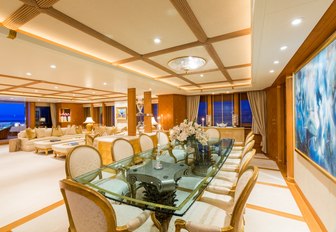 formal dining area with glass-topped table aboard luxury yacht CALLISTO 