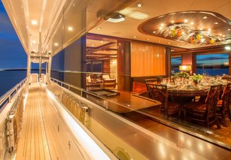 The exterior walkway and formal dining space on board superyacht USHER