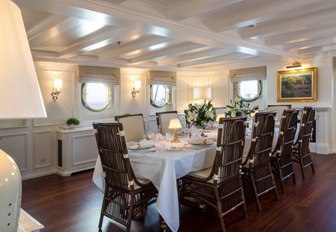 formal dining salon with period furniture and features on board charter yacht Haida 1929