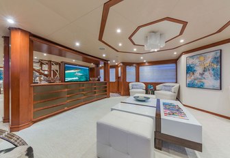 the spacious main salon of charter yacht gota with flat screen tv and sumptuous seating arrangement 