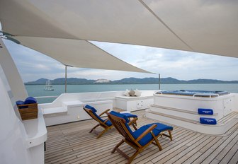 Bimini-covered sundeck with chaise loungers and Jacuzzi aboard expedition yacht ‘Northern Sun’ 