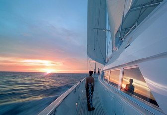 A charterer enjoys the view from the exterior of sailing yacht Spirit of the C's