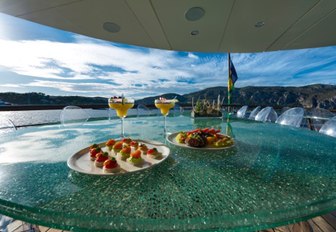 Selection of canapes and refreshments on table of Superyacht CHAKRA