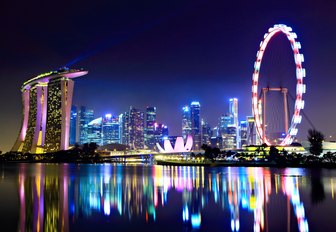 singapore cityscape at night as view from a luxury yacht