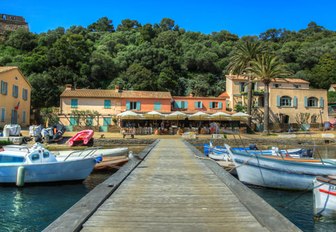 Wooden boats and small motor yachts berthed at the dock of Port-Cros