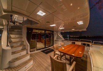 aft deck of superyacht Antonia II with alfresco dining setup