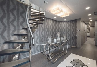 glittering silver staircase on board charter yacht ‘H