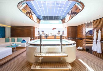 Jacuzzi under skylight in beach club of charter yacht AQUIJO 