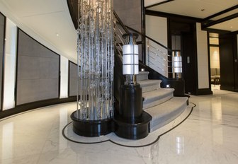 Glass staircase feature on AQUILA yacht