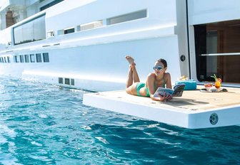 woman social distancing on luxury yacht charter vacation