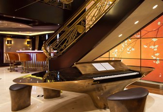 Charter yacht KISMET stairwell and piano with LED light panels in hallway