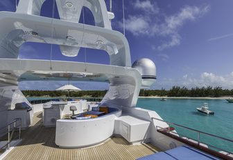 Wide sundeck on luxury yacht M3, with jacuzzi in background and seating areas throughout