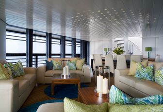 sofas form a lounge in the main salon of motor yacht ‘Ocean Emerald’ 