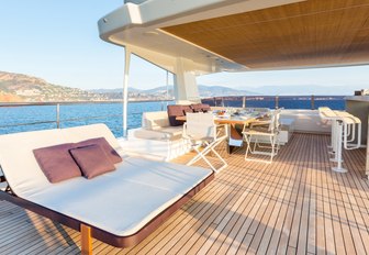 loungers, alfresco dining and bar aboard sundeck of luxury yacht NARVALO 