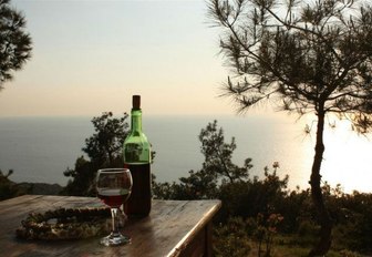 bottle and glass of red wine in Bozcaada, Turkey 