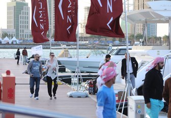 visitors walk the boardwalks at the Qatar International Boat Show