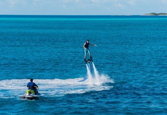 charter guest aboard luxury yacht 'My My My' playing on the flypack