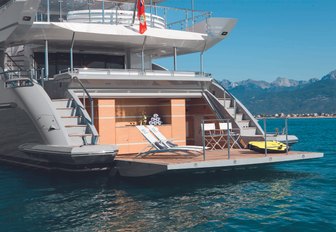 drop-down swim platform forms a chic beach club on board charter yacht ‘H