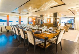 long, rectangular dining table in main salon of luxury yacht ‘Party Girl’