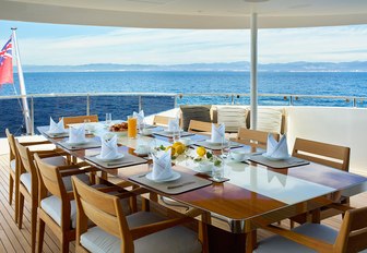 luxe alfresco dining area on the upper deck aft of motor yacht ASYA 