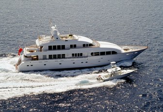 Superyacht M4 cruising next to its super tender