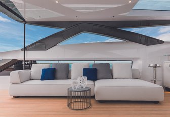 sumptuous sofa under the radar arch on the sundeck aboard luxury yacht Vista Blue